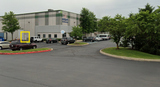 Warehouse parking lot with a yellow box highlighting the building entrance